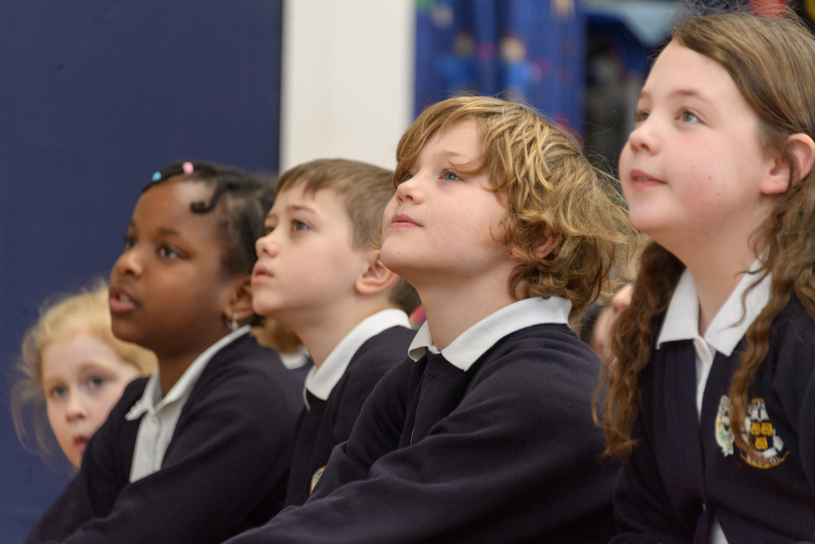a group of students looking at something