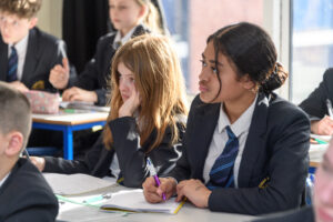 a close up of two students in the classroom