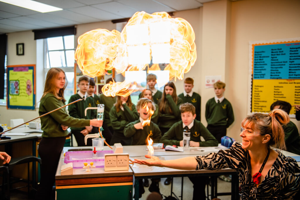teacher doing a cool experiment for the science class